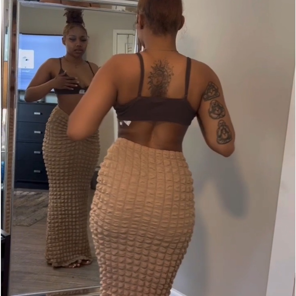 Brown skirt, fits tight but stretchy.